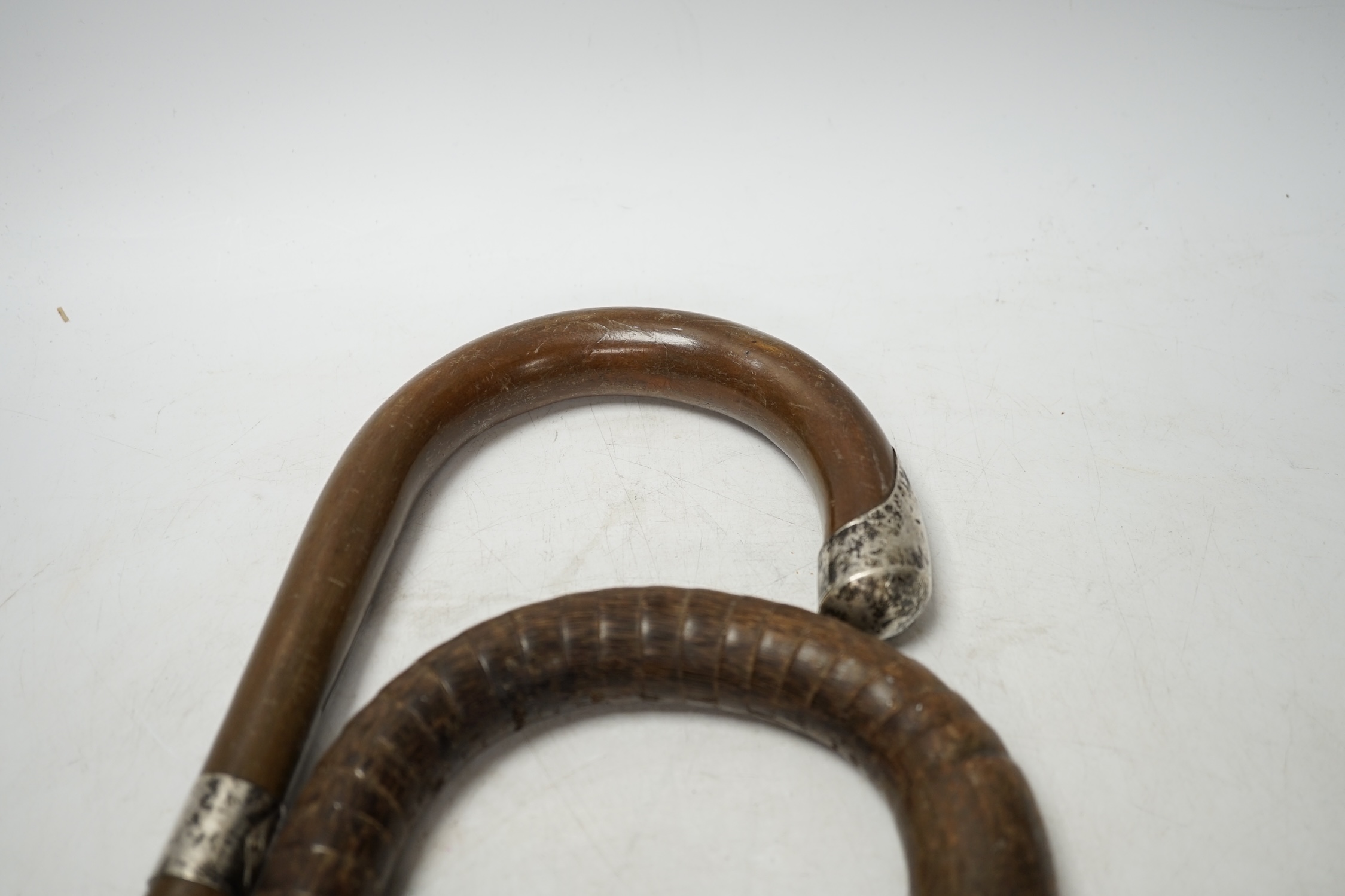 A collection of five various walking sticks/canes including silver mounted, longest 93cm. Condition fair